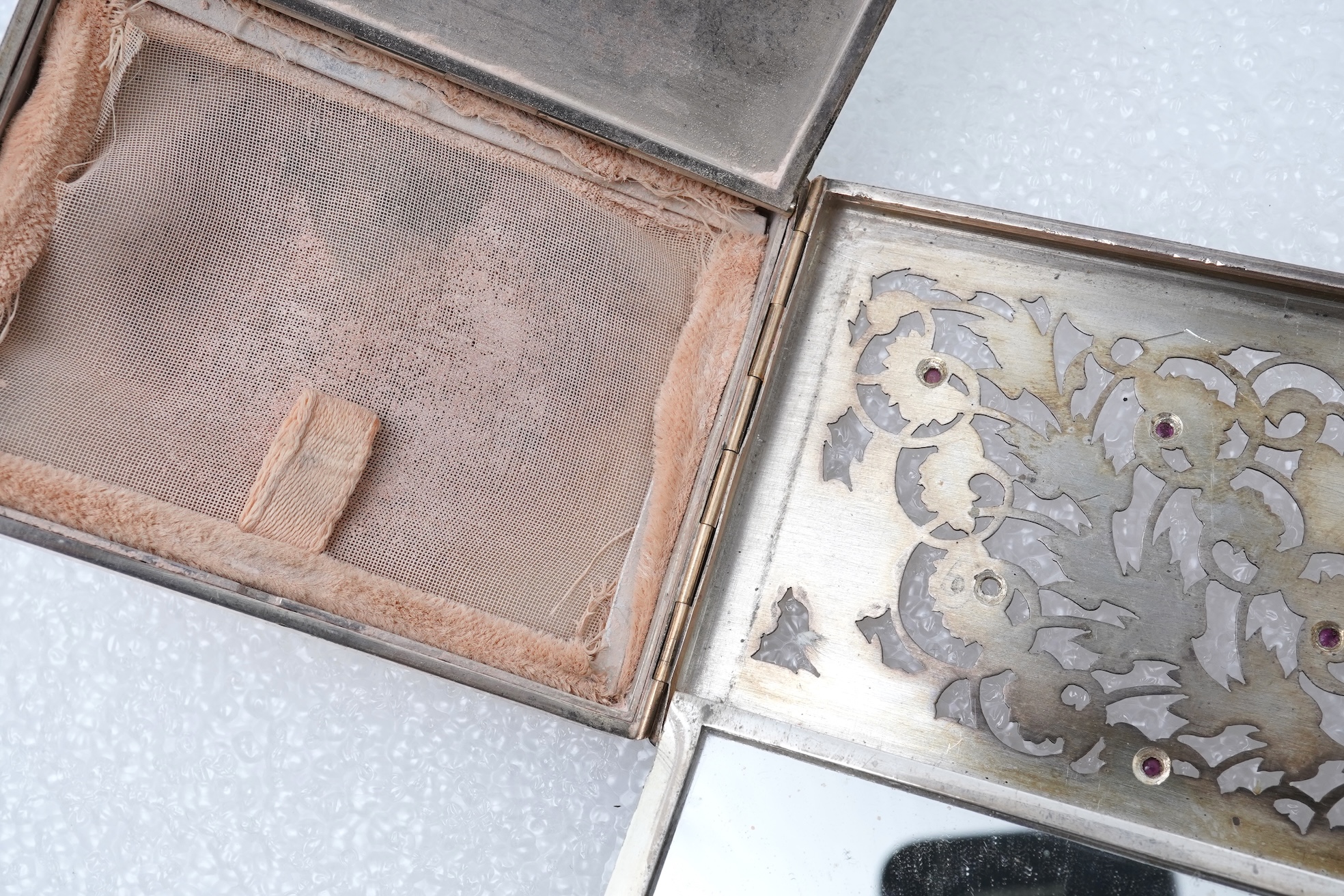 Boucheron, a silver gilt and ruby vanity case, France, 1940s